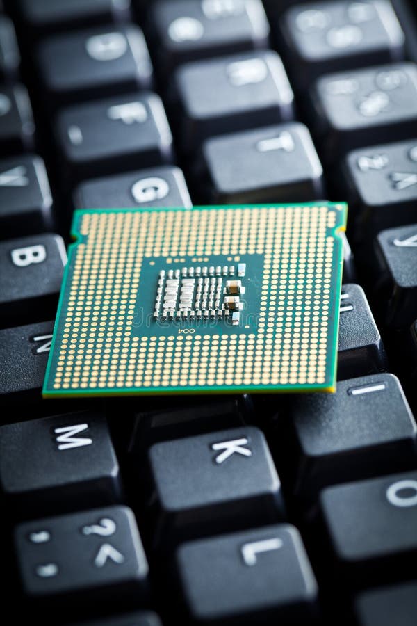 Computer processor on computer keyboard stock photo