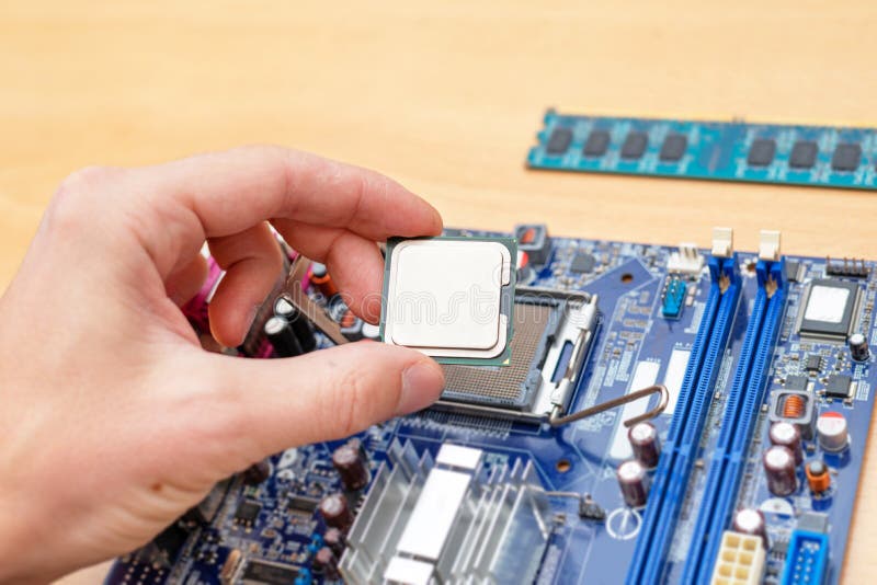 Computer processor installation into motherboard socket royalty free stock image