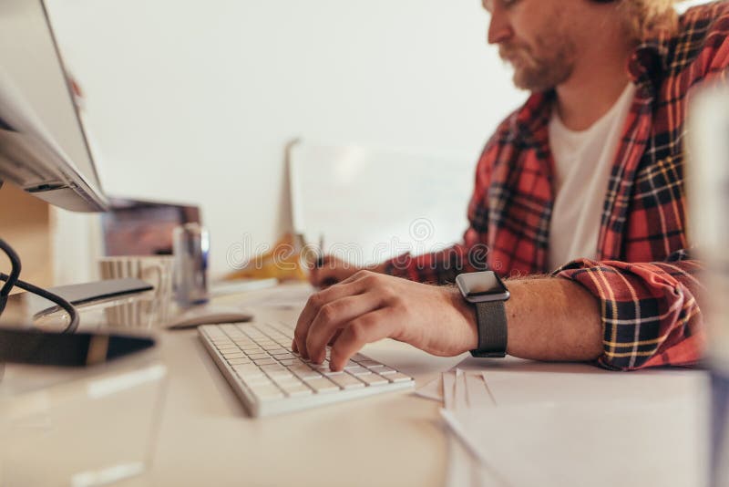 Computer programmer working at the desk stock image