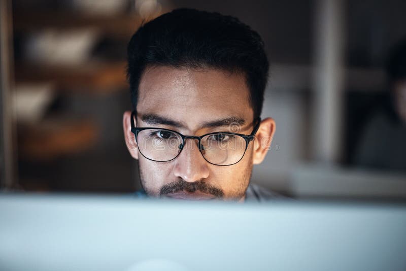 Computer, research and man in glasses for software development, night programming and cybersecurity. Reading, focus and stock images