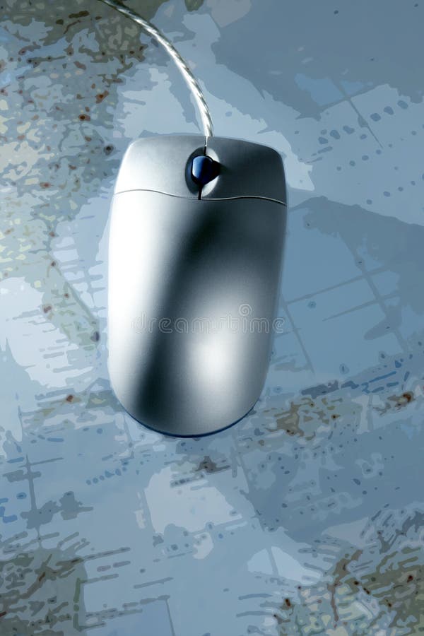 Computer silver wired mouse over blue blurred map. Computer silver wired mouse over blue blurred map