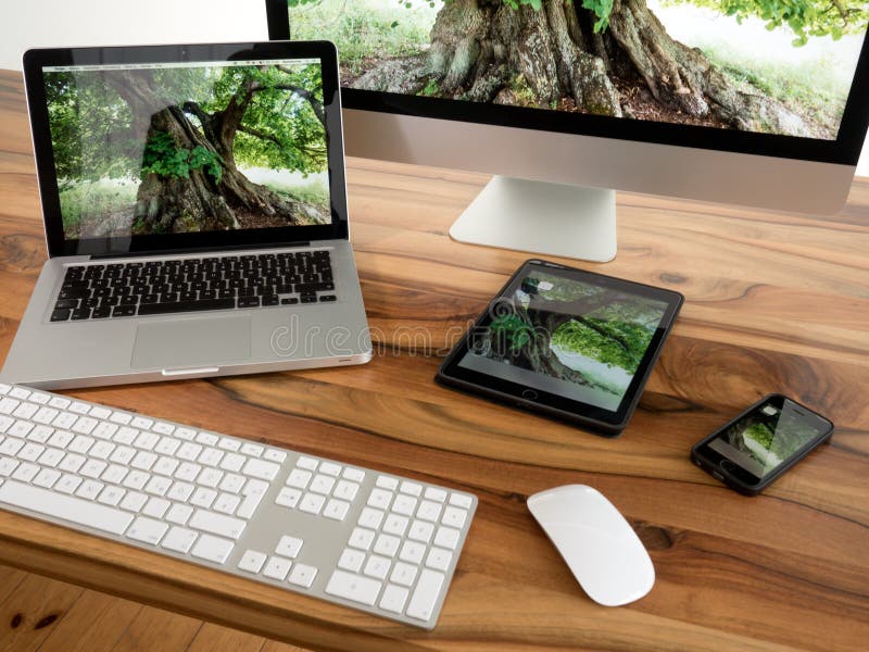 Computer and tablet. IMac, iPad, iPhone, Macbook Pro on table Computer and tablet. IMac, iPad, iPhone, Macbook Pro on table