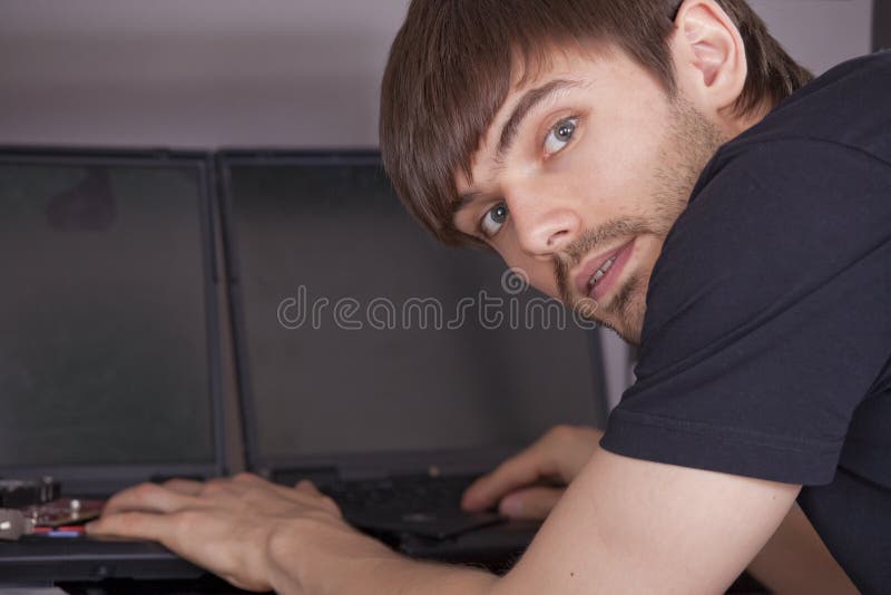 Computer technician with laptops