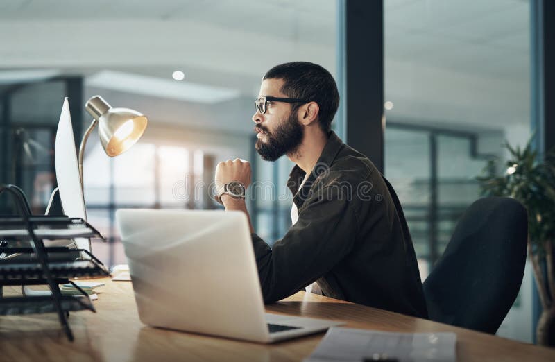 Computer, thinking and reading with business man in office for web designer, UX tools or planning. Coding, night and developer with person in agency for CMS platform, glasses and laptop research.