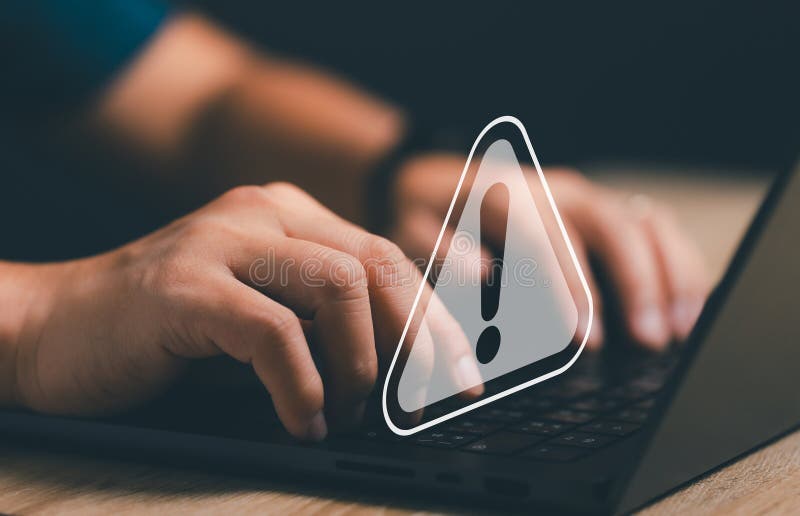 Computer virus malware detected and warning. User or developer working on laptop computer and get alert stock photography
