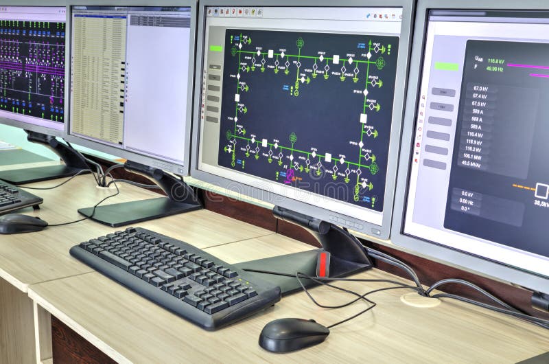 Computers and monitors with schematic diagram for supervisory, control and data acquisition royalty free stock photography