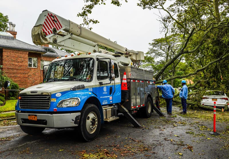 BROOKLYN, NEW YORK - AUGUST 6, 2020: Con Edison repair crew restores power and clears street the aftermath of severe weather as tropical storm Isaias hits New York City