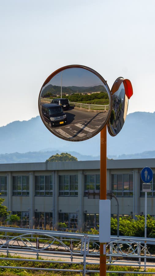 Concave Mirror on The Roadside, there is a warning sign nearby indicated that for walking only.