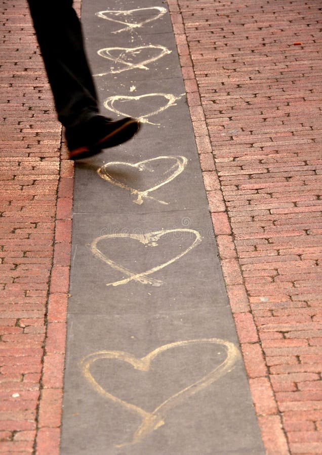Hearts drawn on a a street in the city center of Florence, Italy . The modern part of the city .Conceptual image of love , valentine's, day. artistic zone, urban concept. Hearts drawn on a a street in the city center of Florence, Italy . The modern part of the city .Conceptual image of love , valentine's, day. artistic zone, urban concept