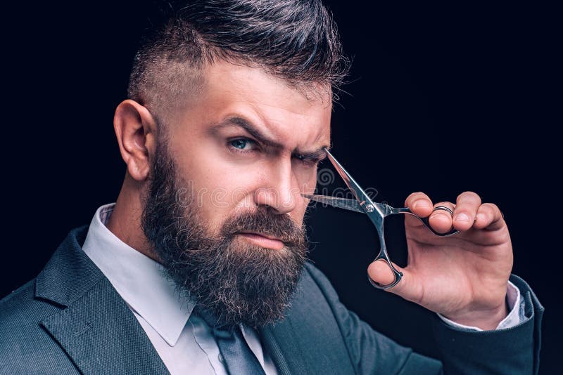 Scissors concept. Bearded man, bearded hipster. Stylish man beard. Barber scissors. Vintage barbershop, shaving. Long beard, caucasian hipster with moustache. Scissors concept. Bearded man, bearded hipster. Stylish man beard. Barber scissors. Vintage barbershop, shaving. Long beard, caucasian hipster with moustache