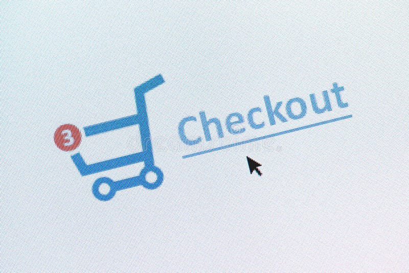 Closeup photo of shopping cart with items and checkout link on the monitor screen. Closeup photo of shopping cart with items and checkout link on the monitor screen