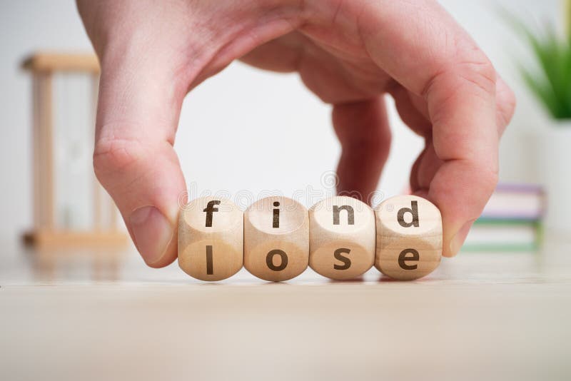 Concept of antonym find and lose on wooden blocks stock photos