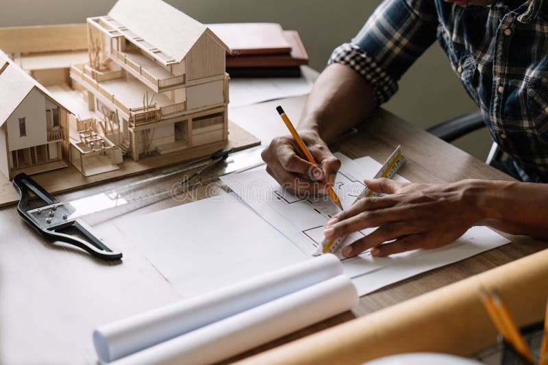 Concept Architects, Engineer or Architect Holding Pen Drawing on