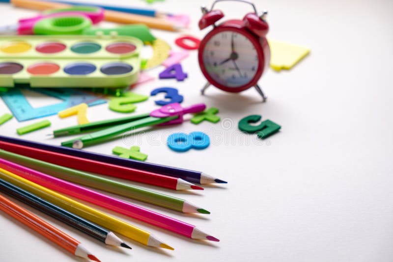 Concept Back To School. Alarm Clock and School Supplies Stock Image