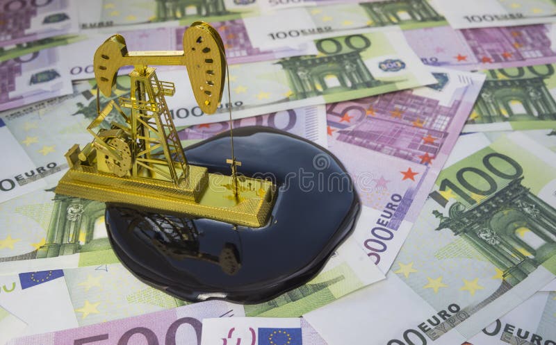 Concept d'huile de pompe de perçage d'or photos stock