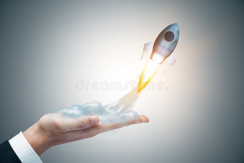 Businessman hand holding abstract launching rocket on gray background. Startup concept. 3D Rendering. Businessman hand holding abstract launching rocket on gray background. Startup concept. 3D Rendering