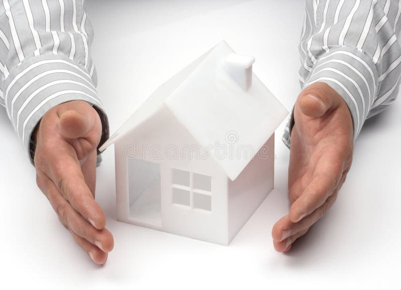 Hands and house model. Real property or insurance concept. Hands and house model. Real property or insurance concept