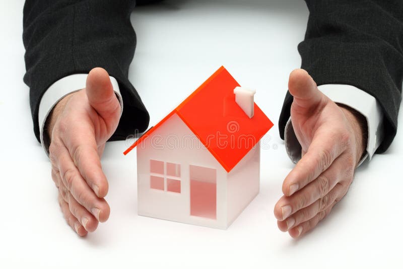 Hands and house model. Real property or insurance concept. Hands and house model. Real property or insurance concept