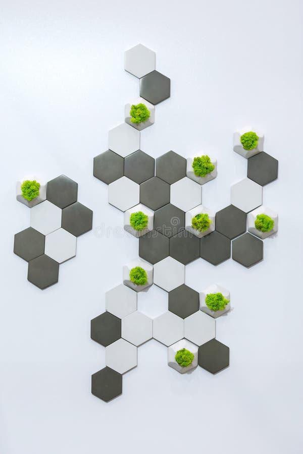 Concept design of the wall, white and gray concrete bricks and moss growing in them. Ecological office decor, white background stock image