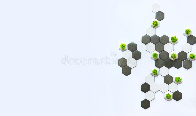 Concept design of the wall, white and gray concrete bricks and moss growing in them. Ecological office decor, white background stock photography