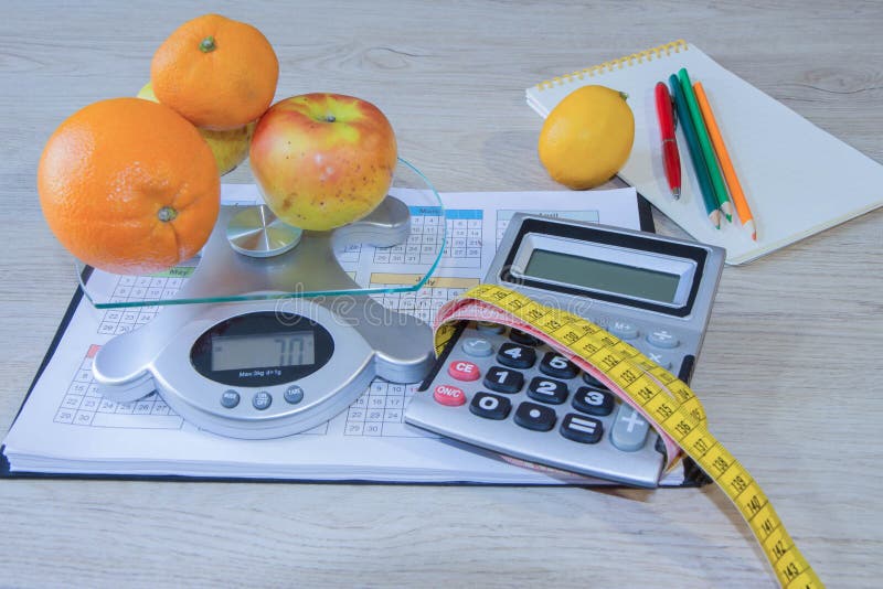 Concept of diet. Low-calorie fruit diet. Diet for weight loss. Measuring tape and fruits on the table. Vegetarian diet for weight