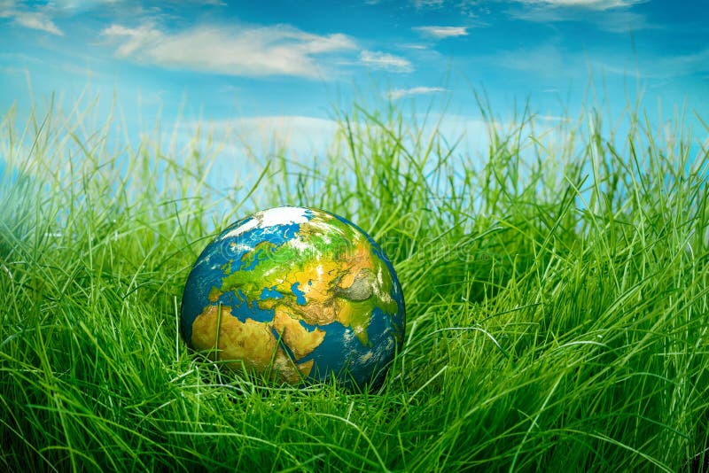 Globe lies on green grass. Concept - Earth Day.