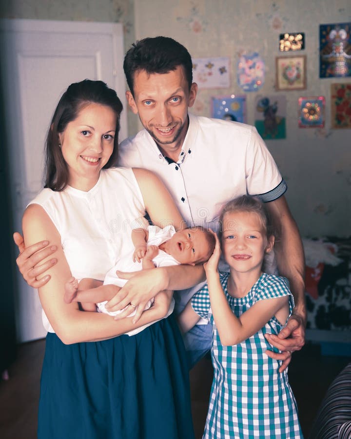 Concept of family happiness - daddy,daughter and mom with a newb stock images Concept of family happiness - daddy,daughter and mom with a newb stock images