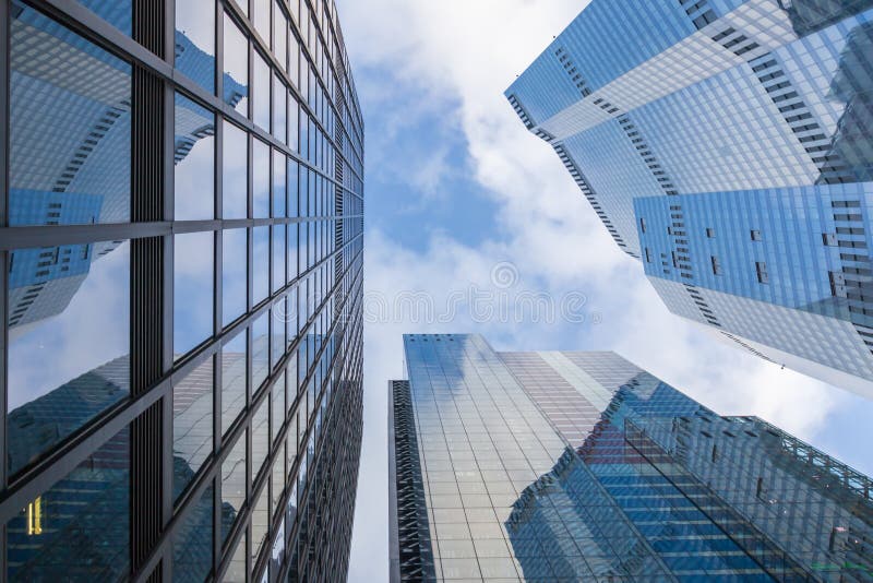 Concept of financial economics future. Business offices skyscrapers on blue sky background