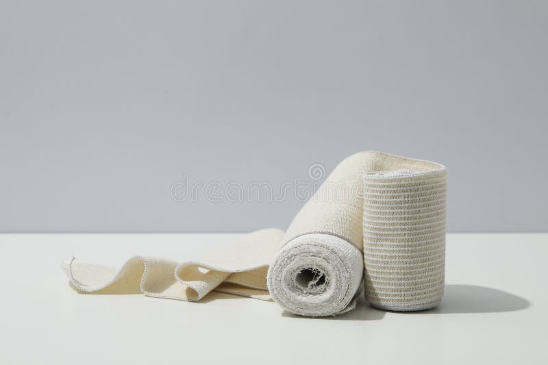 Concept of first aid, different bandage on white table royalty free stock photo