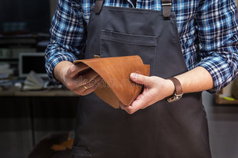 Concept of Handmade Craft Production of Leather Goods. Stock Photo