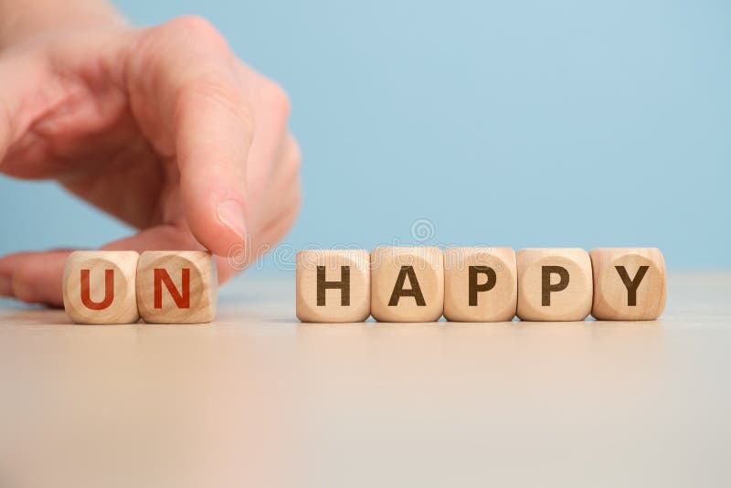 The concept of happy and unhappy as an antonym and change stock photography