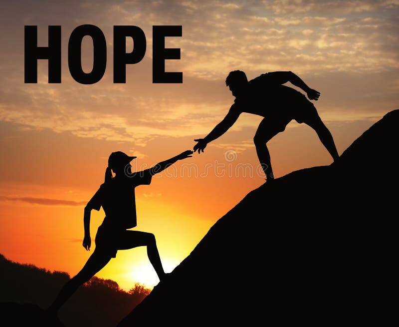 Concept of hope. Man helping woman to climb on hill at sunset stock photography