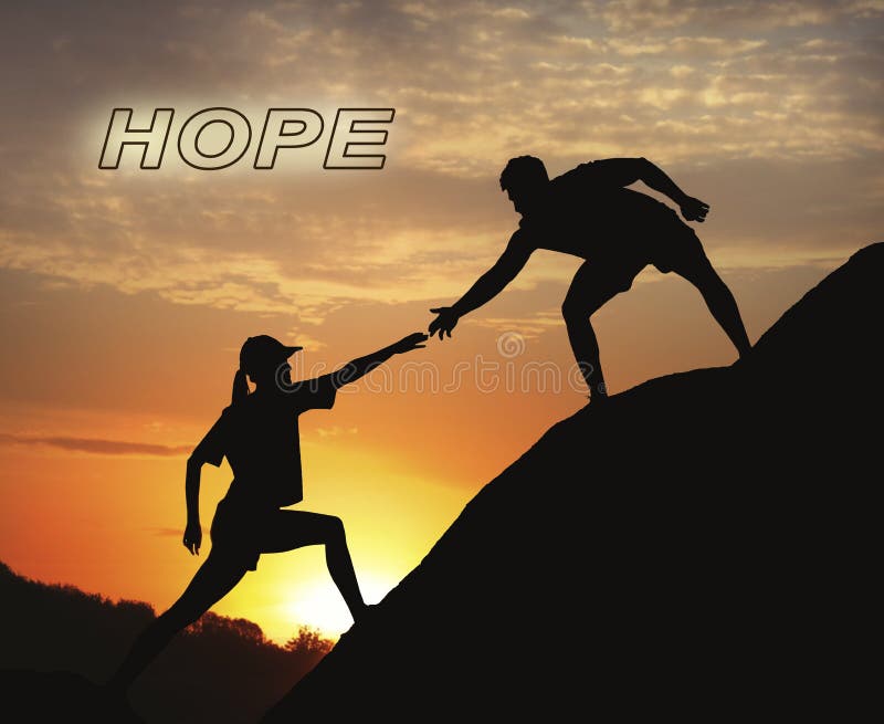 Concept of hope. Man helping woman to climb on hill at sunset stock image