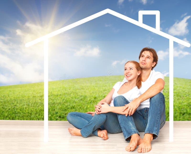 Concept: housing and mortgage for young families. couple dreaming of home