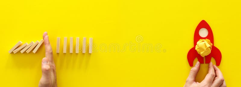 Concept image of crisis and opportunity. domino effect versus rocket taking off royalty free stock images