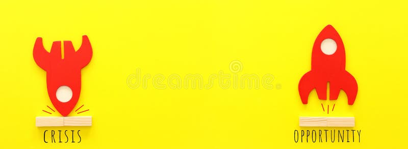 Concept image of crisis and opportunity. one rocket taking off while the second is crashing stock images