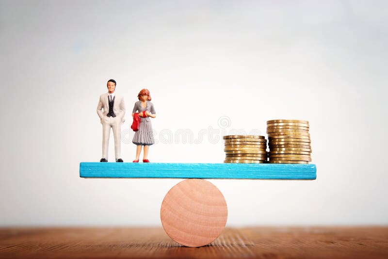 Concept image of married couple balancing stack of coins on seesaw stock photo