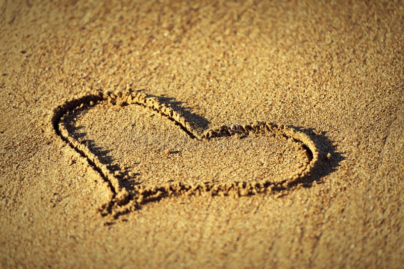 Concept of love. heart in the sand