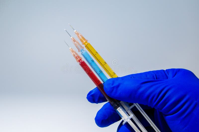 The concept of medical injections for cosmetology and new invented drugs. Set of medical syringes with injections. The concept of medical injections for cosmetology and new invented drugs. Set of medical syringes with injections.