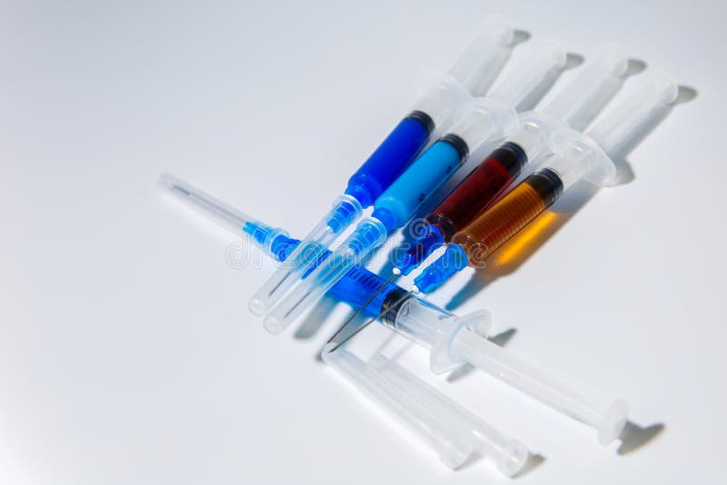 The concept of medical injections for cosmetology and new invented drugs. Set of medical syringes with injections.