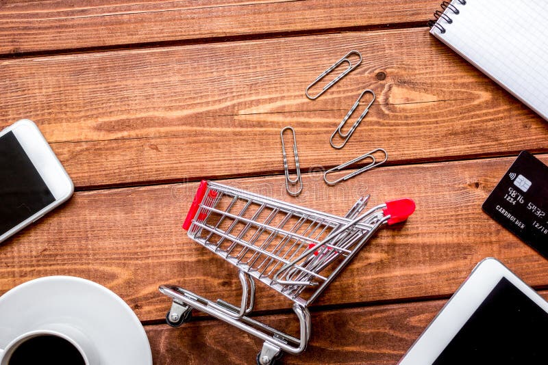 Concept online shopping with smartphone on wooden background mock up royalty free stock photography Concept online shopping with smartphone on wooden background mock up royalty free stock photography