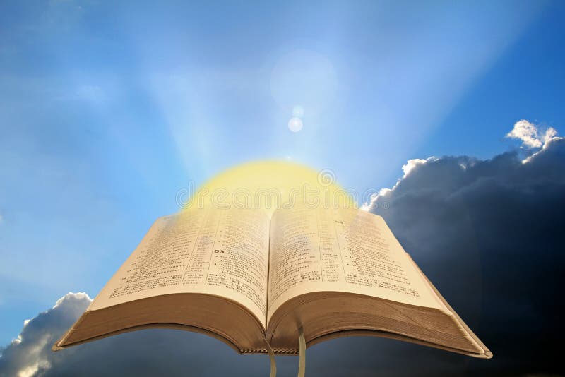 Concept photo of divine spiritual light showing open holy bible with sun rising against a stormy sky ideal for own text. Concept photo of divine spiritual light showing open holy bible with sun rising against a stormy sky ideal for own text.