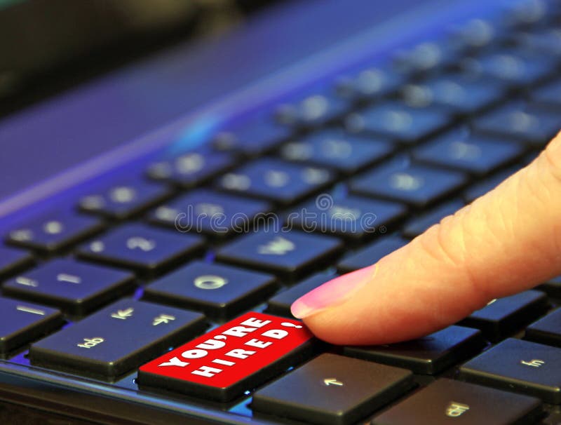Digital online internet red you`re hired button finger push pressing press pushing keyboard switch royalty free stock photo Digital online internet red you`re hired button finger push pressing press pushing keyboard switch royalty free stock photo