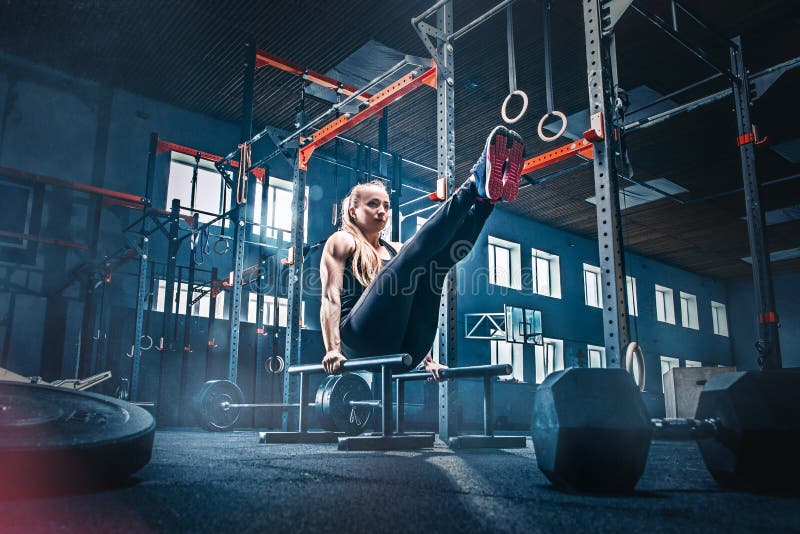 Concept: power, strength, healthy lifestyle, sport. Powerful attractive muscular woman at CrossFit gym royalty free stock photography Concept: power, strength, healthy lifestyle, sport. Powerful attractive muscular woman at CrossFit gym royalty free stock photography