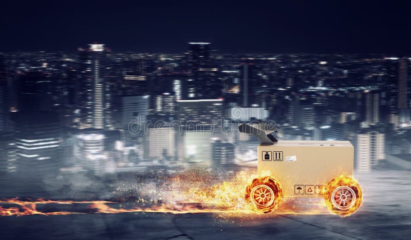 Priority Cardboard box with racing wheels on fire. Fast shipping by road. royalty free stock images Priority Cardboard box with racing wheels on fire. Fast shipping by road. royalty free stock images