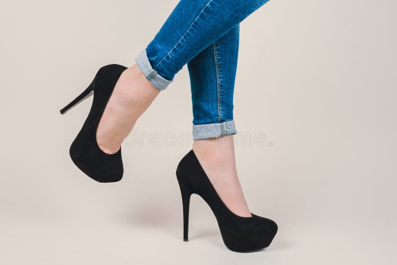 Concept of rolled up denim casual trousers pants, girlish urban stock image Concept of rolled up denim casual trousers pants, girlish urban stock image