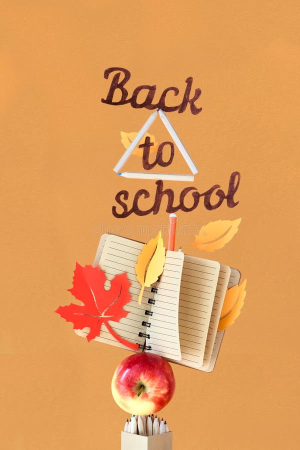 Concept still life with text \'Back to school\' balancing on pyramide of school supplies stock image Concept still life with text \'Back to school\' balancing on pyramide of school supplies stock image