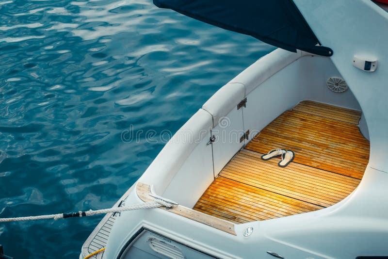 Stern of a motor yacht moored to shore closeup Water Transport Concept. Stern of a motor yacht moored to shore closeup Water Transport Concept