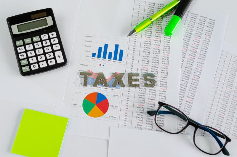 Word Taxes spelled on top of financial documents with calculator and eyeglasses stock images Word Taxes spelled on top of financial documents with calculator and eyeglasses stock images