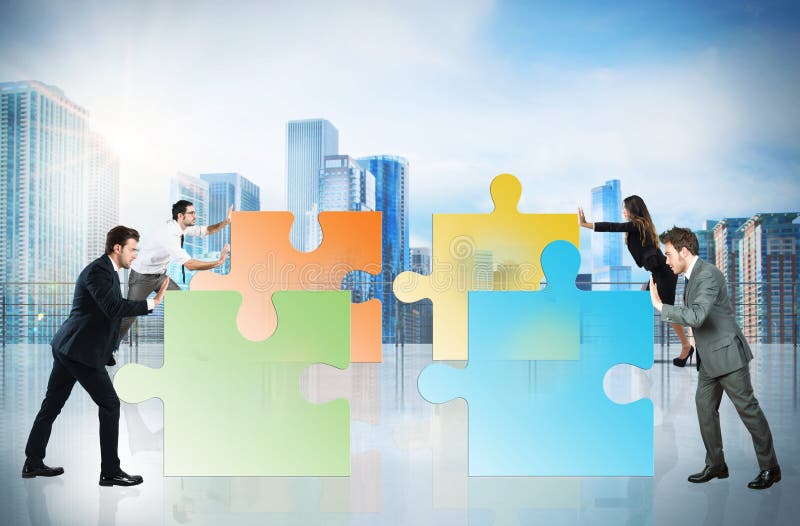 Concept of teamwork and partnership with businesspeople and puzzle. royalty free stock photo Concept of teamwork and partnership with businesspeople and puzzle. royalty free stock photo